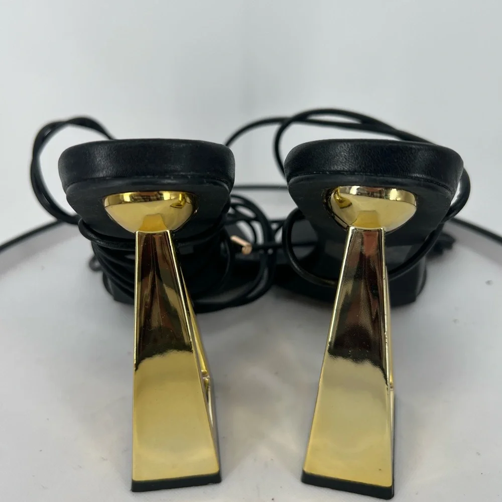 FASHION NOVA STAY WINNING WRAP UP HEELS ‎ IN BLACK GOLD NOVELTY HEELS